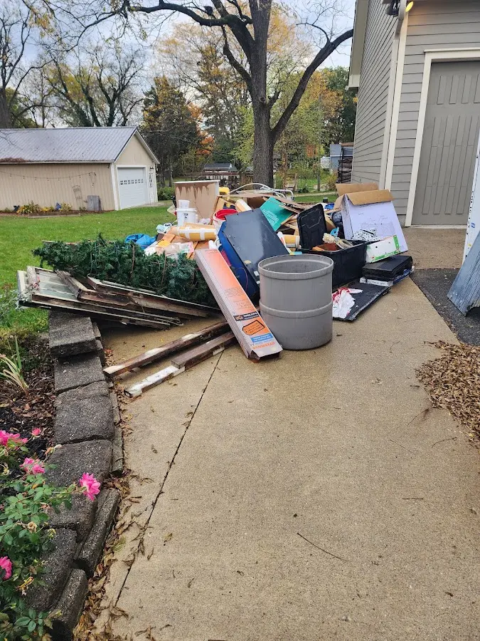 Dumpster being loaded with debris for Demolition Dumpster Rental in North Franklin